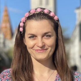 Trinity cookies customer - woman with brown hair and pink flowers on her head